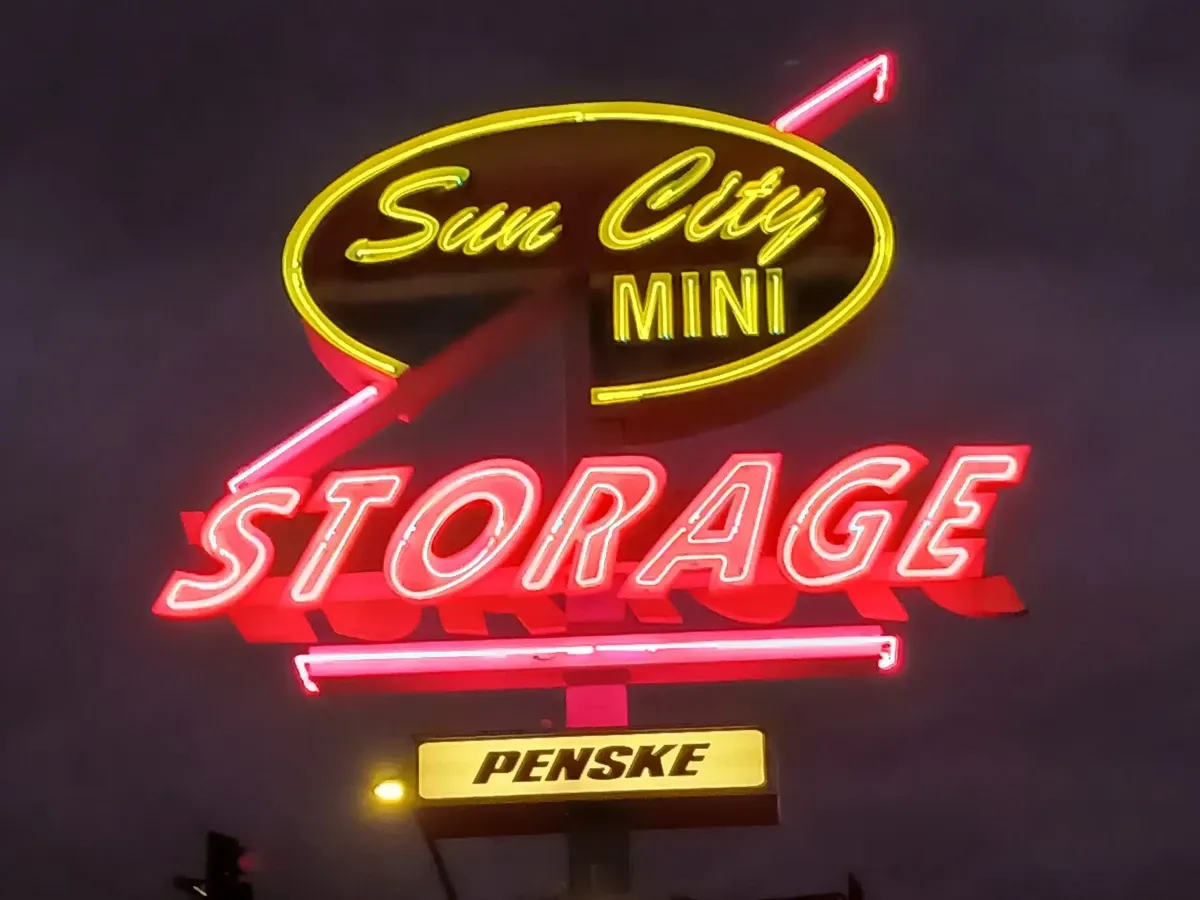 Sun City Mini Storage Sign at Night